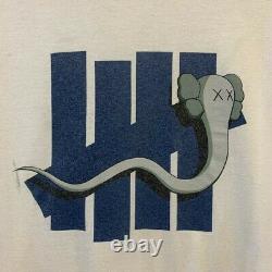 KAWS OriginalFake x Undefeated Bendy Five Strike T-Shirt (White / XL) supreme