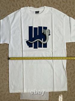 KAWS OriginalFake x Undefeated Bendy Five Strike T-Shirt (White / XL) supreme