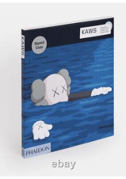 Kaws Signed Book Phaidon. Brand new. Includes T-shirt In Sizes. S/M/L